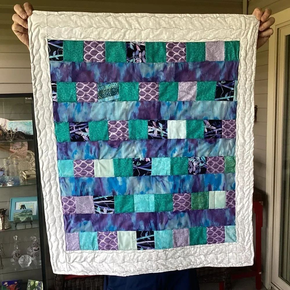NWT. Hand Crafted Patchwork Quilt with Blues, Purples and Teals Accents